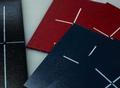 Flexible vinyl cassette, blue or black (left and front). Rigid Vinyl cassette, red (background).